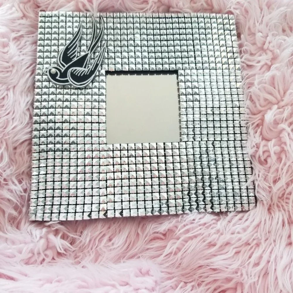Modern studded wall mirror